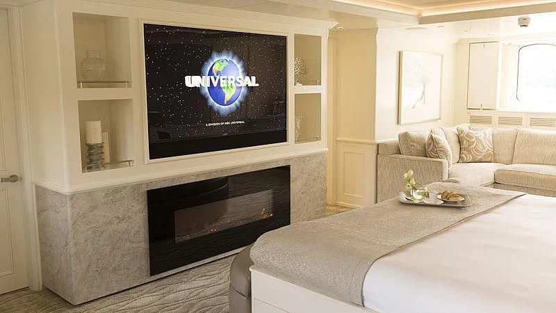 a living room with a fireplace aboard ENDEAVOUR 2 Yacht for Sale