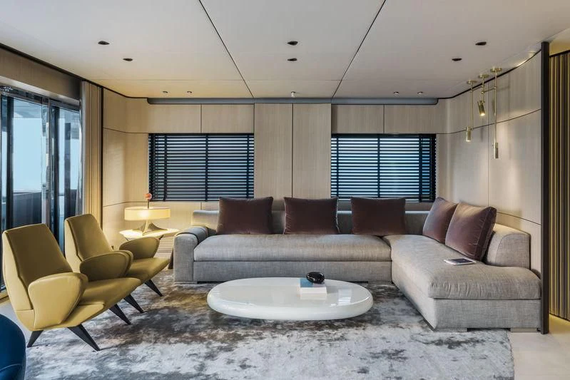 a living room with a couch and a table aboard ENDEAVOUR 2 Yacht for Sale