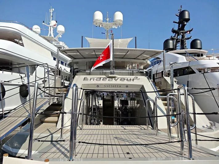 a boat with a flag on the front aboard ENDEAVOUR 2 Yacht for Sale