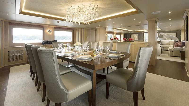 a large dining room with a large table and chairs aboard ENDEAVOUR 2 Yacht for Sale