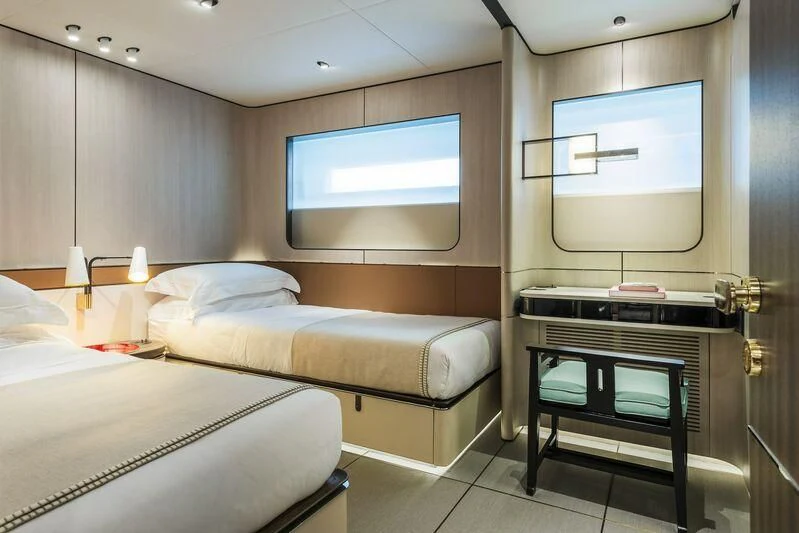 a room with two beds and a tv aboard ENDEAVOUR 2 Yacht for Sale