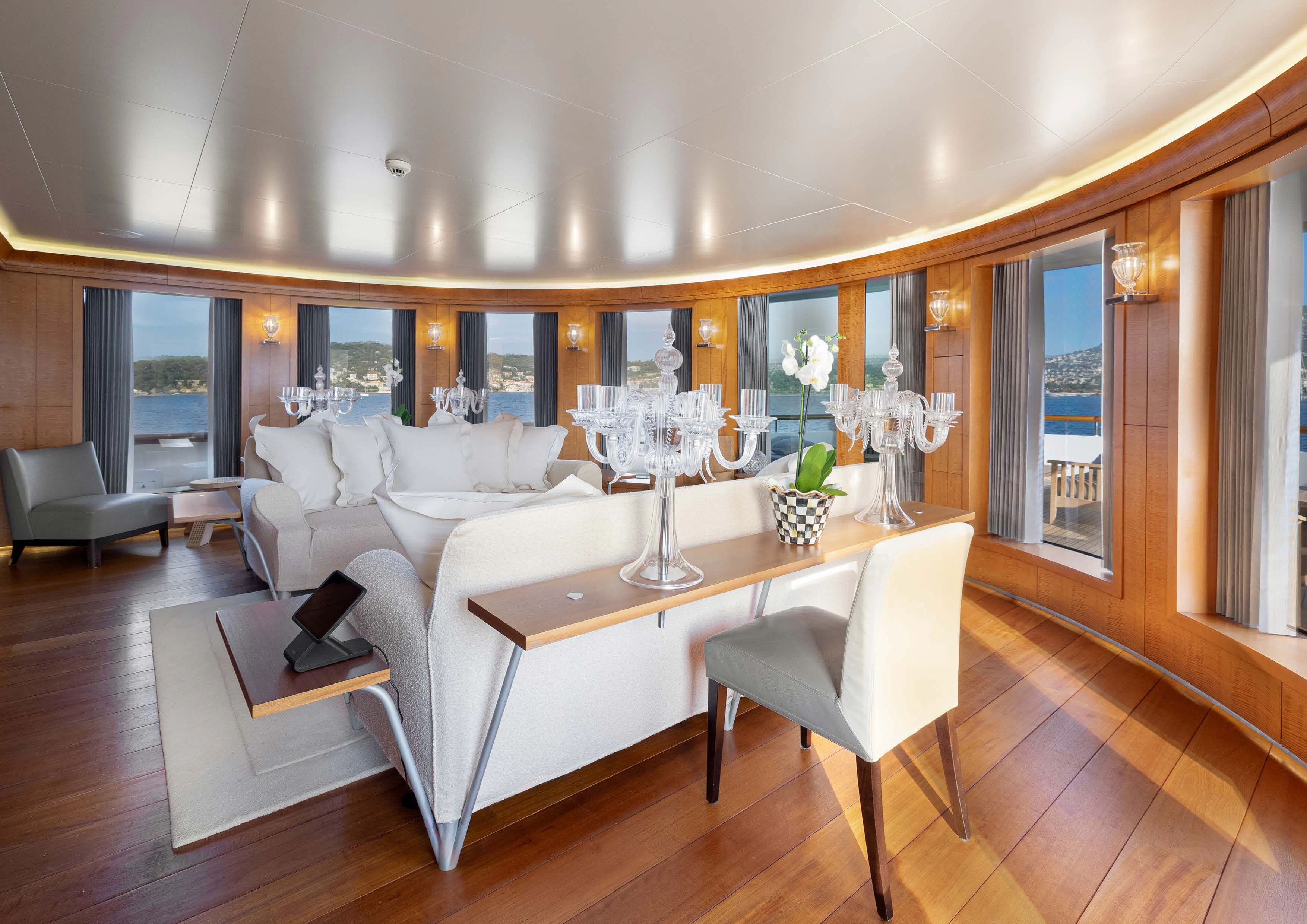 a large living room with a large window aboard WEDGE TOO Yacht for Sale
