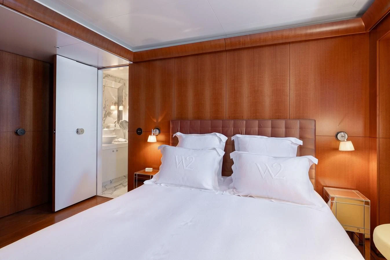 a large bed with white sheets aboard WEDGE TOO Yacht for Sale