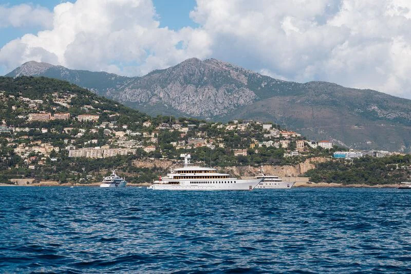 a large body of water with a mountain in the background aboard WEDGE TOO Yacht for Sale