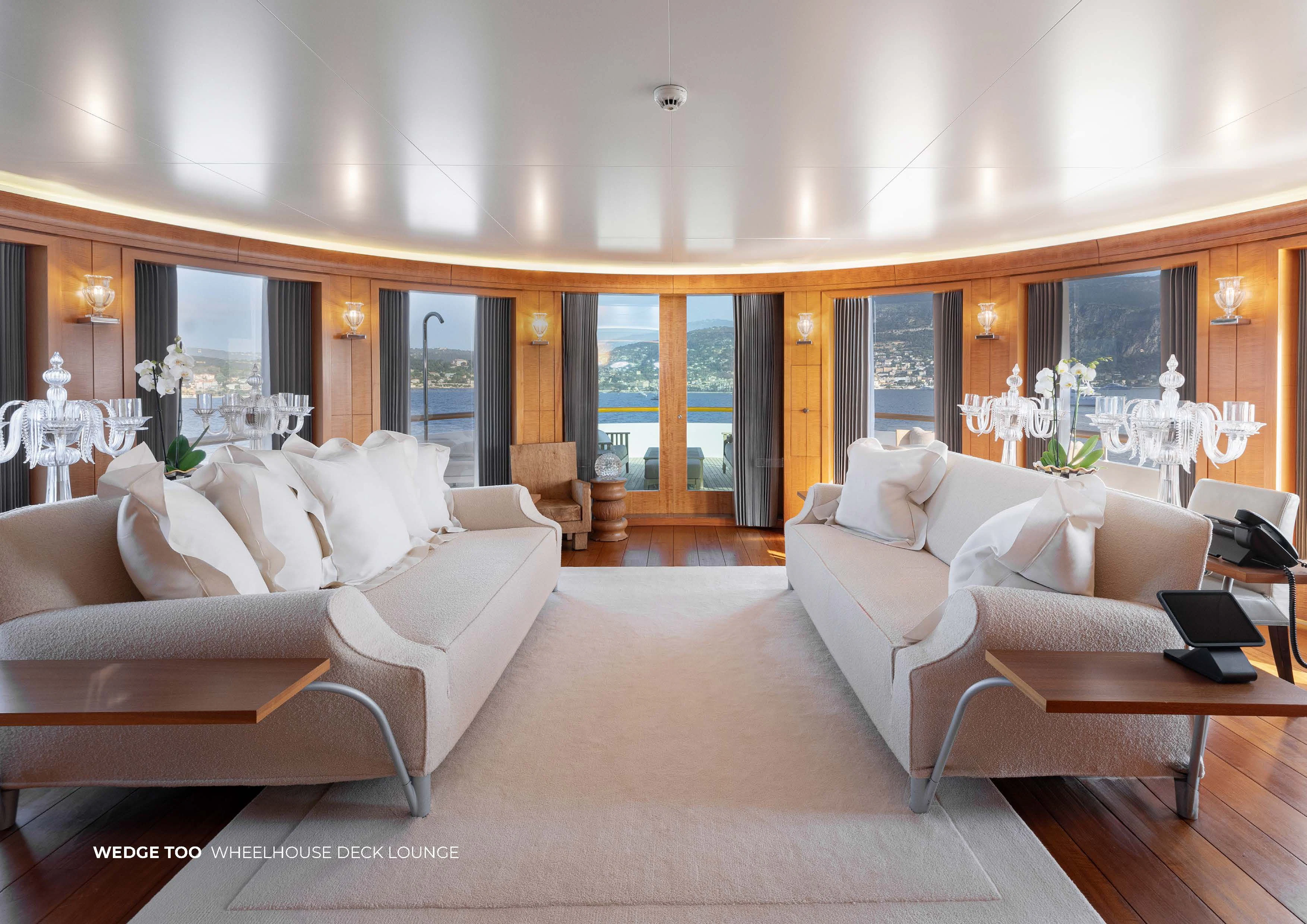 a living room with couches aboard WEDGE TOO Yacht for Sale