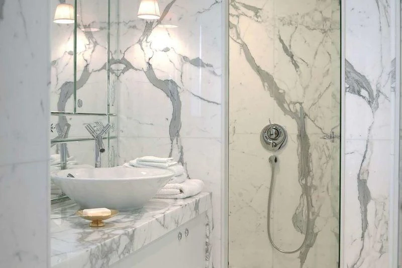 a bathroom with a sink and shower aboard WEDGE TOO Yacht for Sale