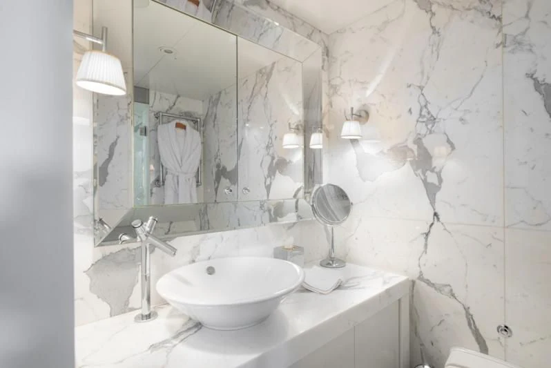 a bathroom with a large mirror aboard WEDGE TOO Yacht for Sale
