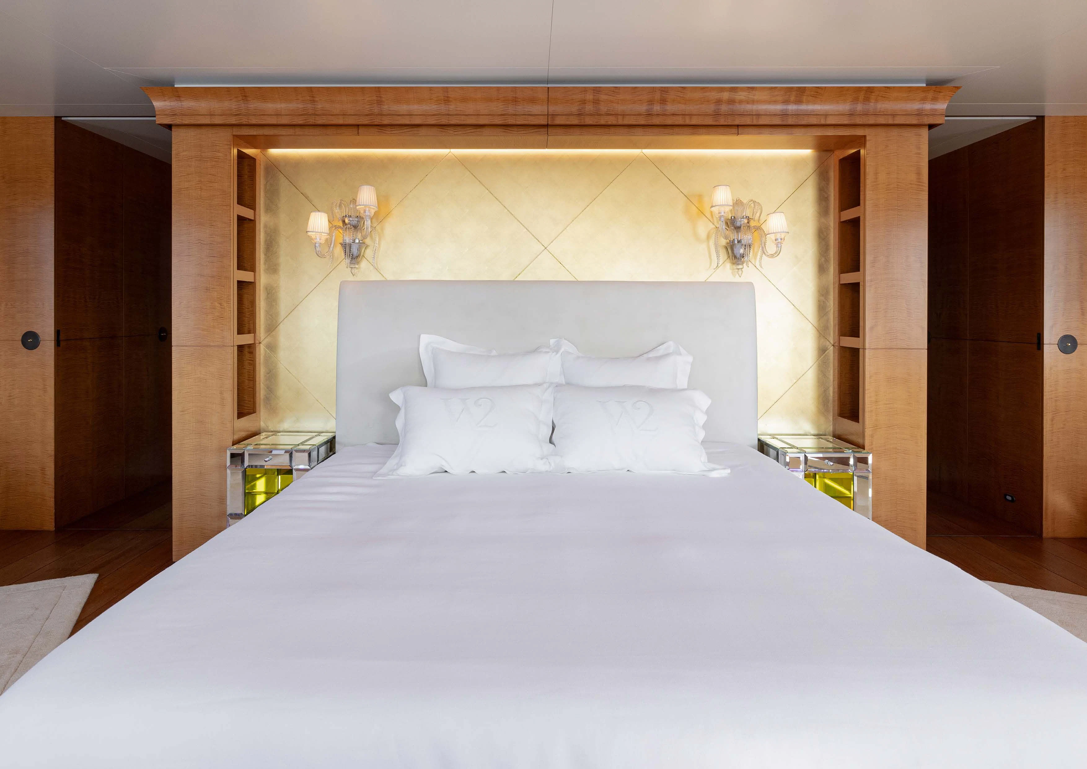 a bed with white sheets aboard WEDGE TOO Yacht for Sale