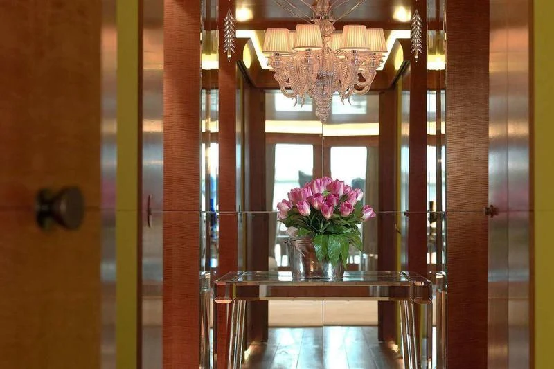 a vase of flowers on a table aboard WEDGE TOO Yacht for Sale