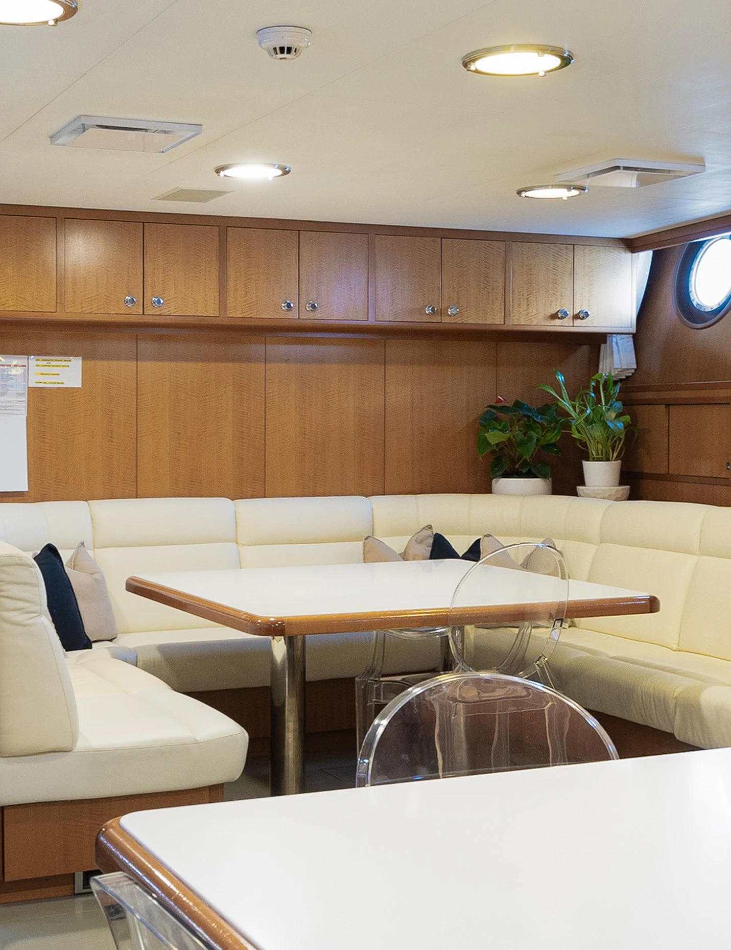 a room with a table and chairs aboard WEDGE TOO Yacht for Sale