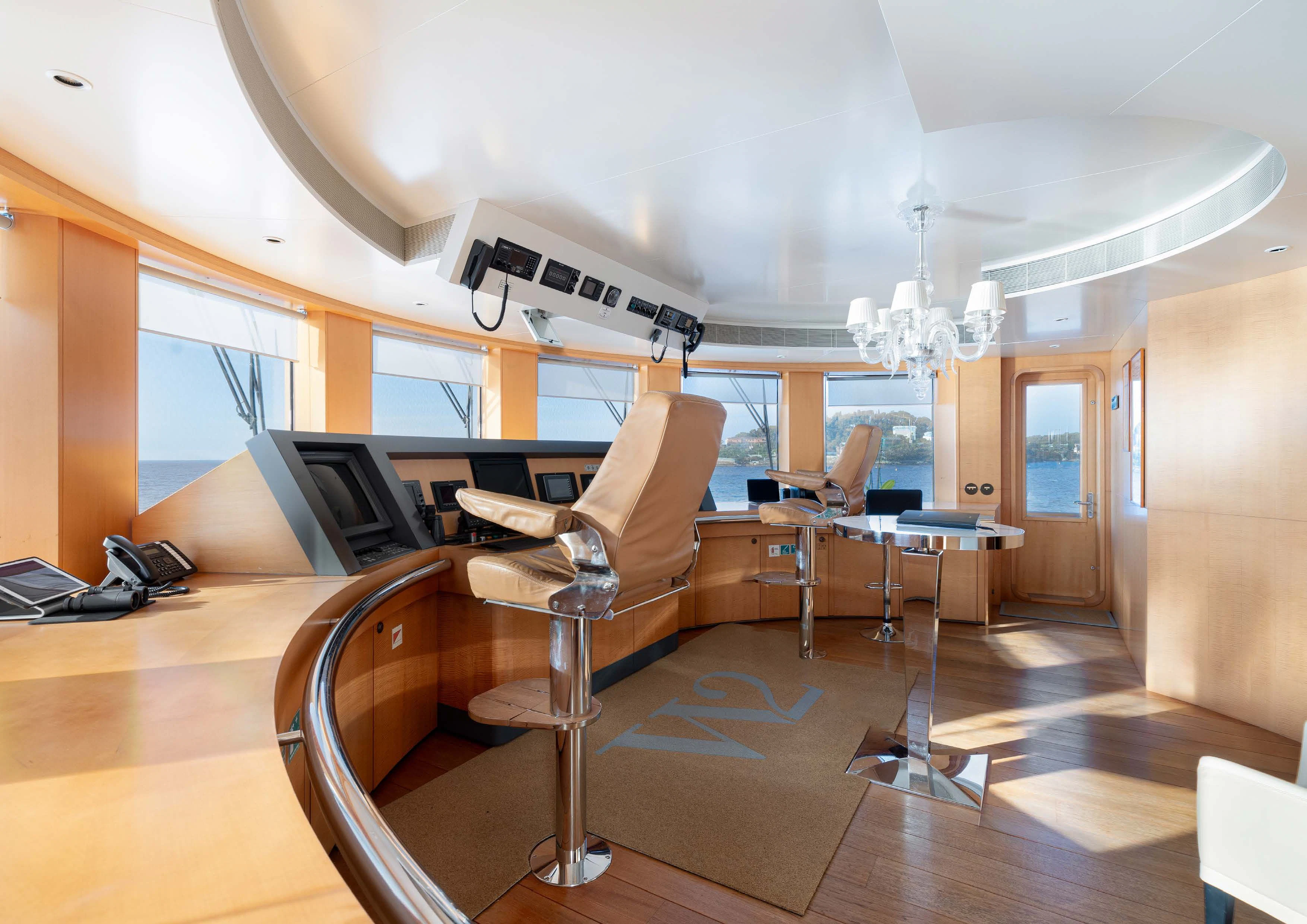 a living room with a couch and a table aboard WEDGE TOO Yacht for Sale