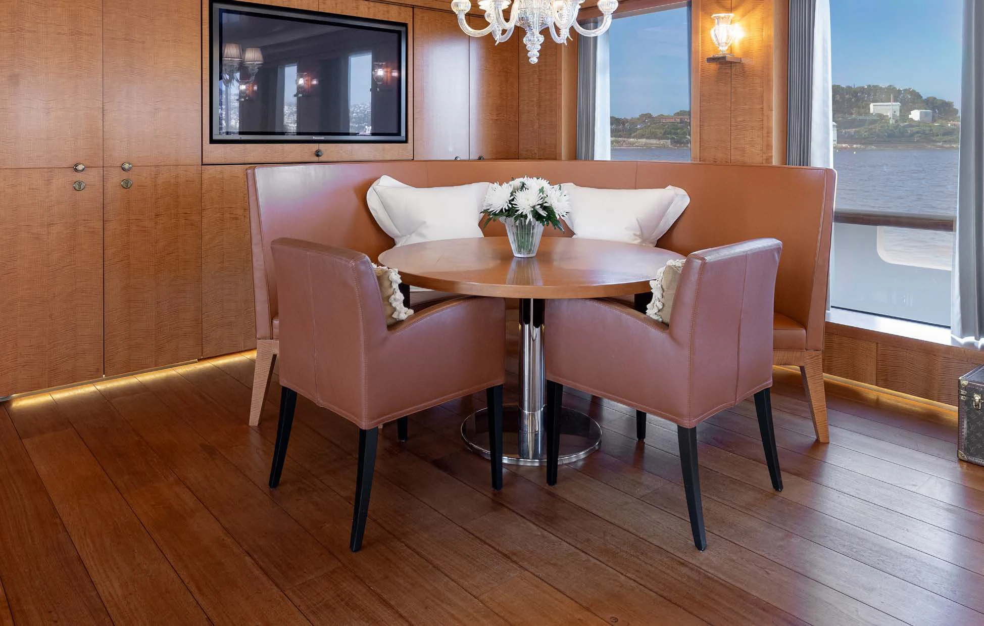 a table and chairs in a room aboard WEDGE TOO Yacht for Sale