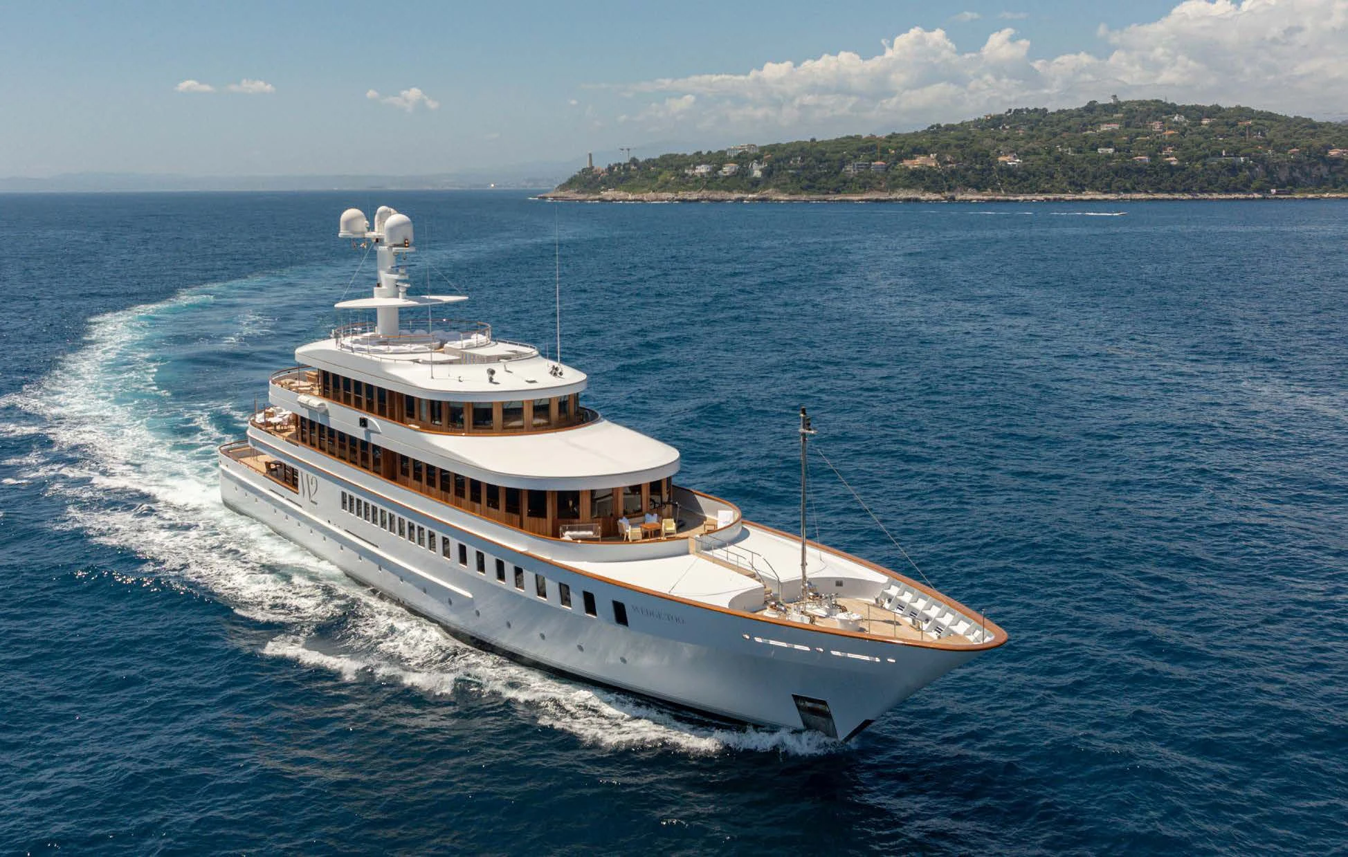 a large white boat on the water aboard WEDGE TOO Yacht for Sale
