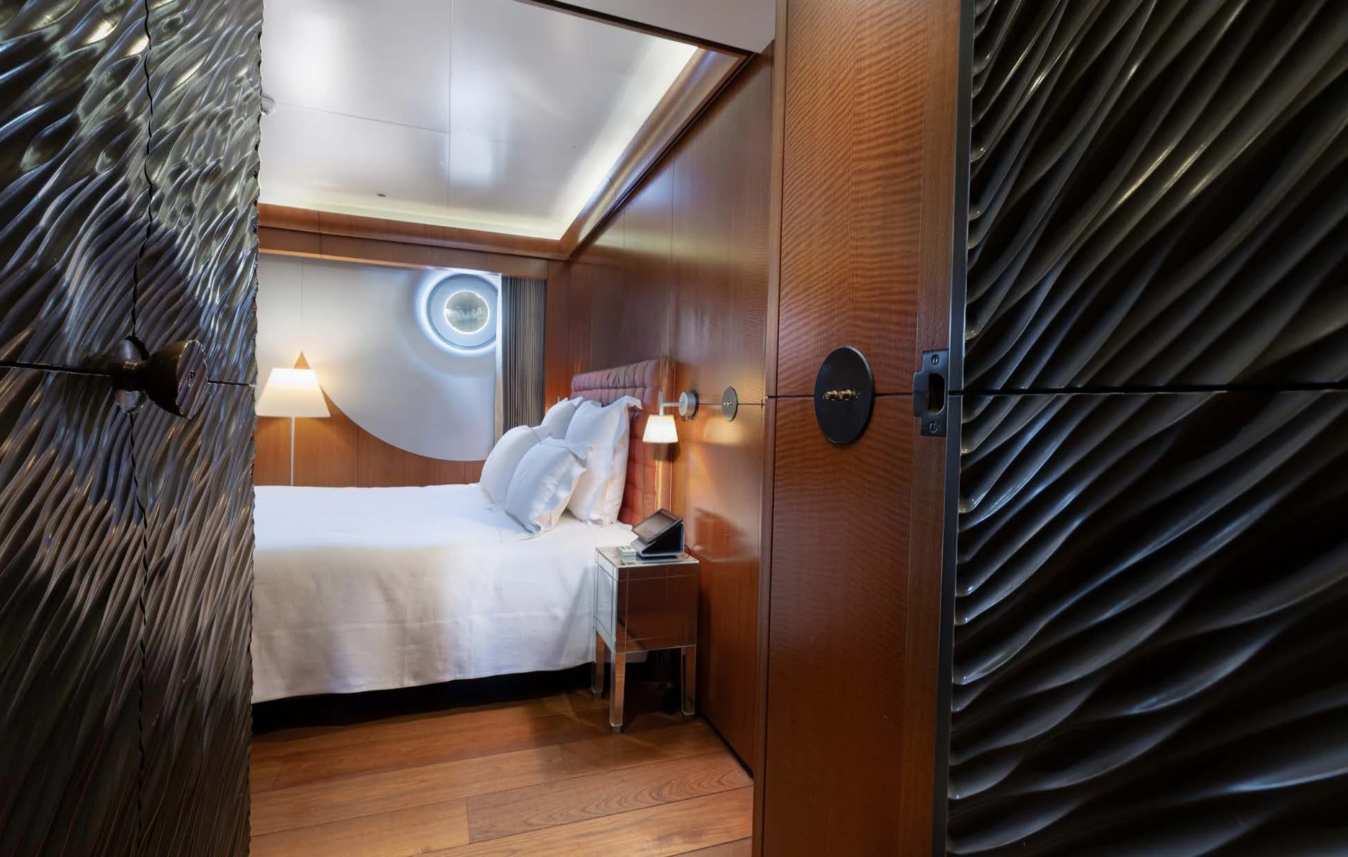 a room with a bed and a curtain aboard WEDGE TOO Yacht for Sale
