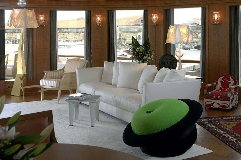 a living room with a large green ball on the floor aboard WEDGE TOO Yacht for Sale
