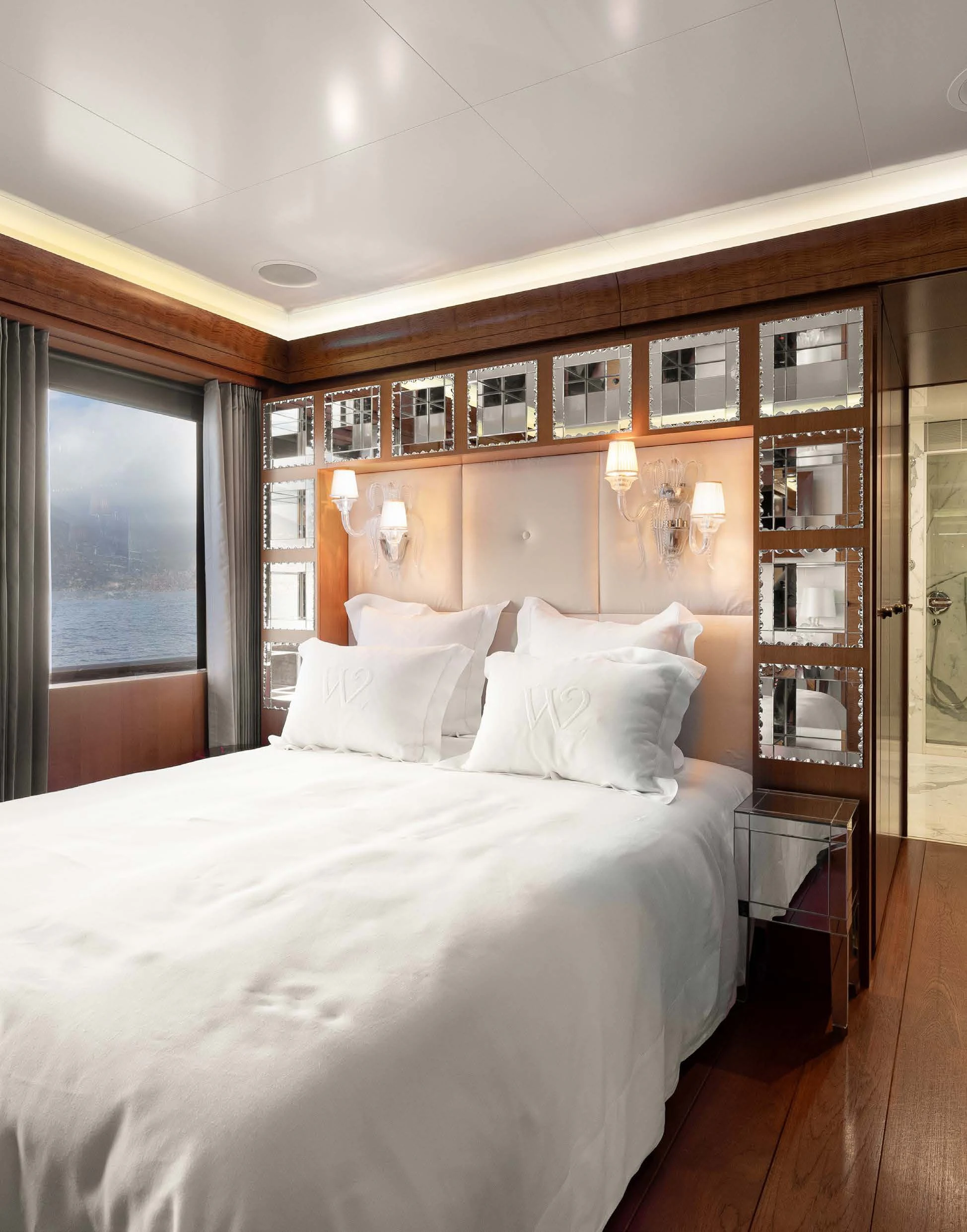 a bed with white sheets aboard WEDGE TOO Yacht for Sale