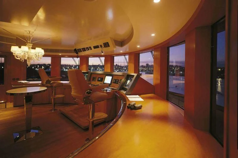 a room with a table and chairs aboard WEDGE TOO Yacht for Sale