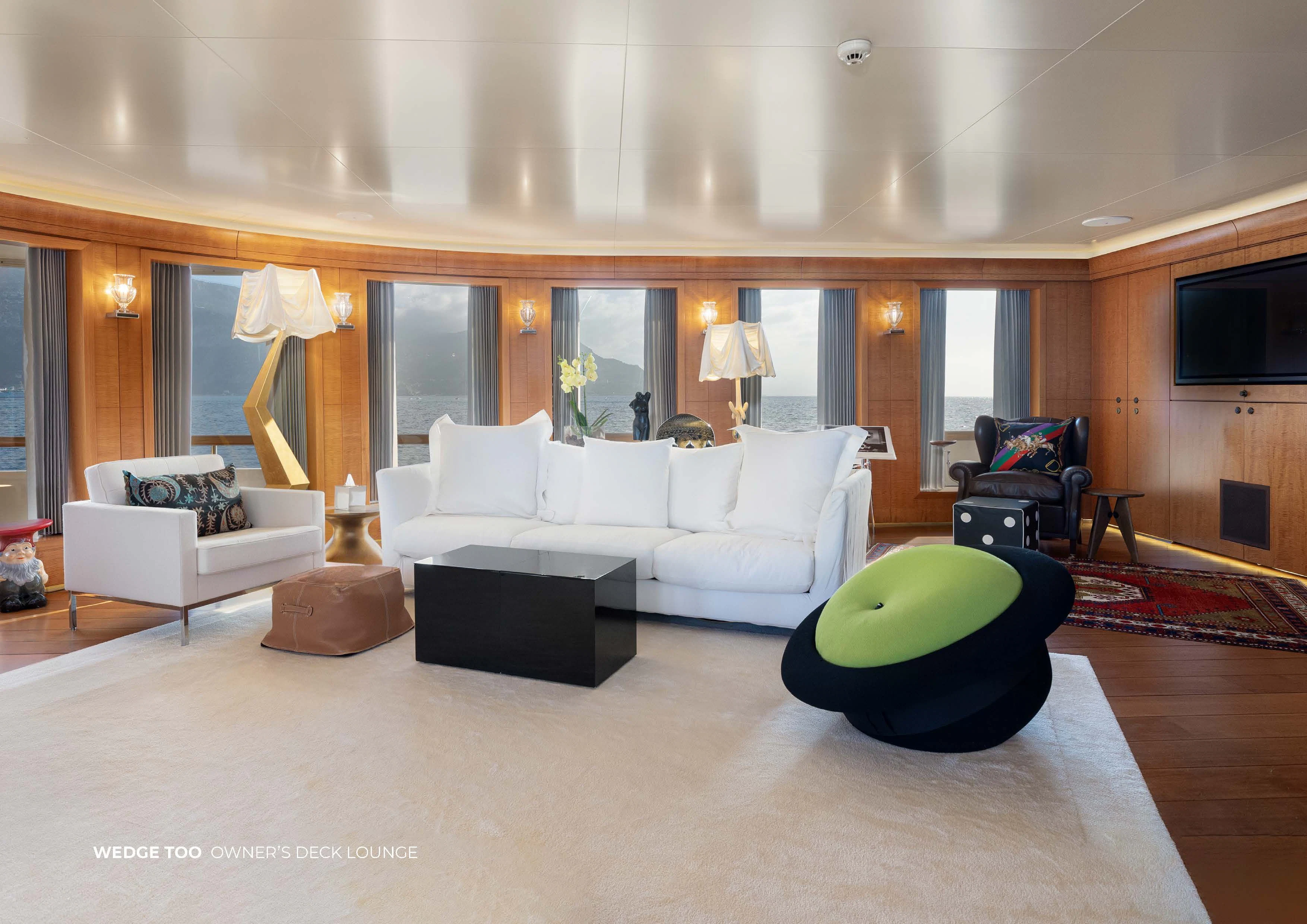 a large living room with a large green ball aboard WEDGE TOO Yacht for Sale