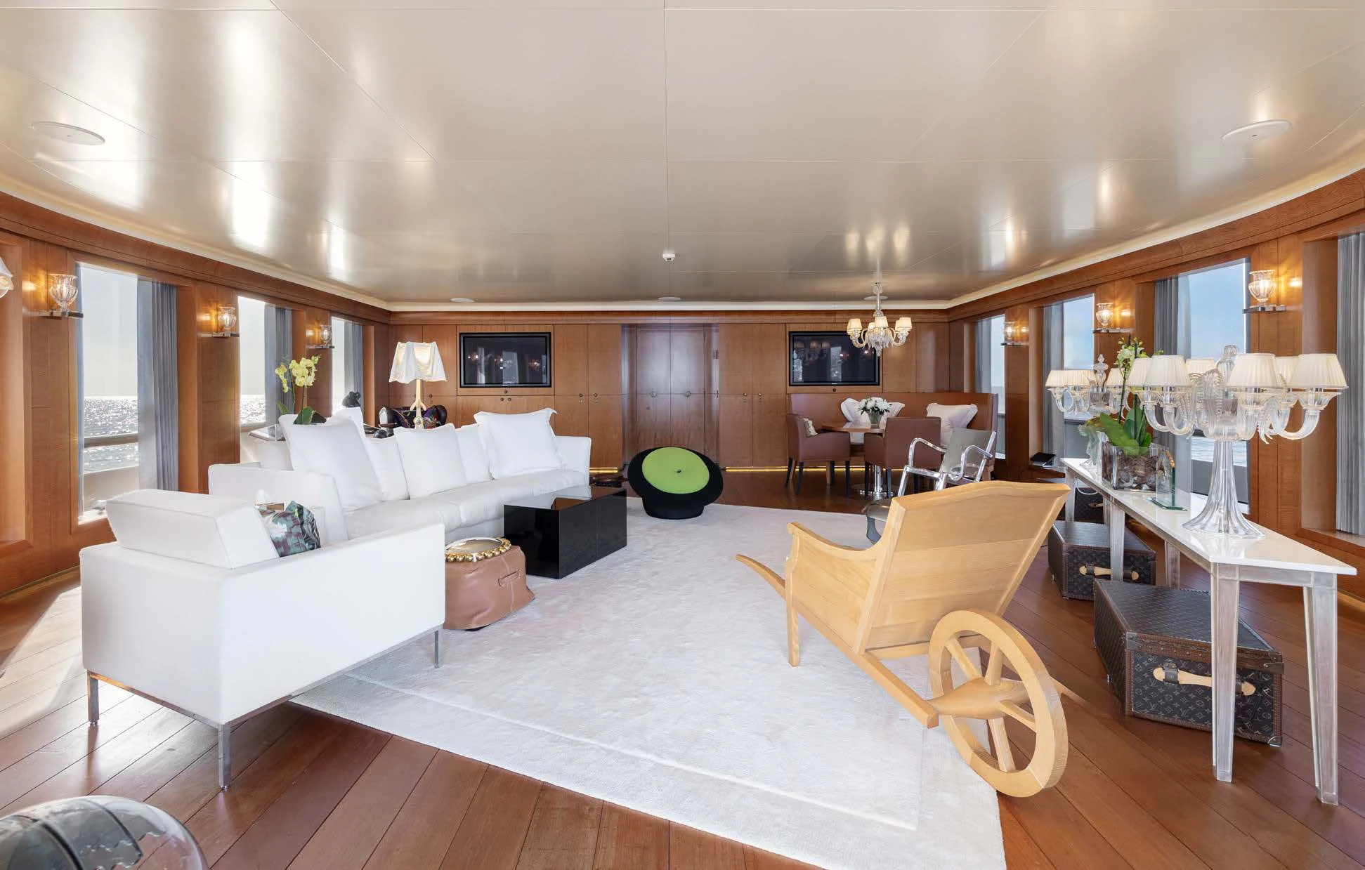 a large living room with a large white couch and a large white bed aboard WEDGE TOO Yacht for Sale