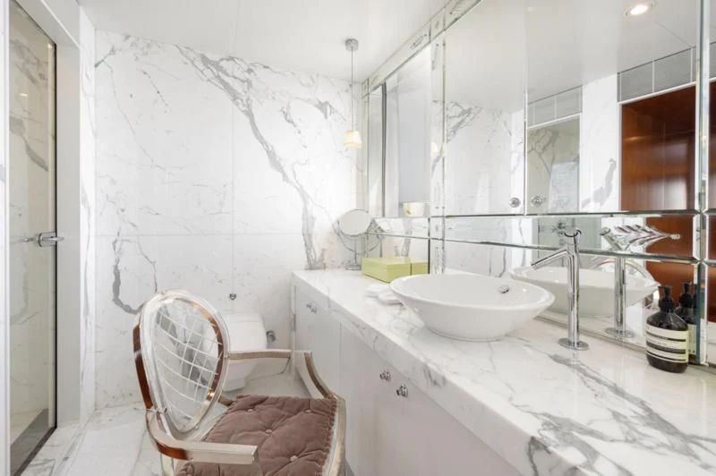a bathroom with a sink and a mirror aboard WEDGE TOO Yacht for Sale