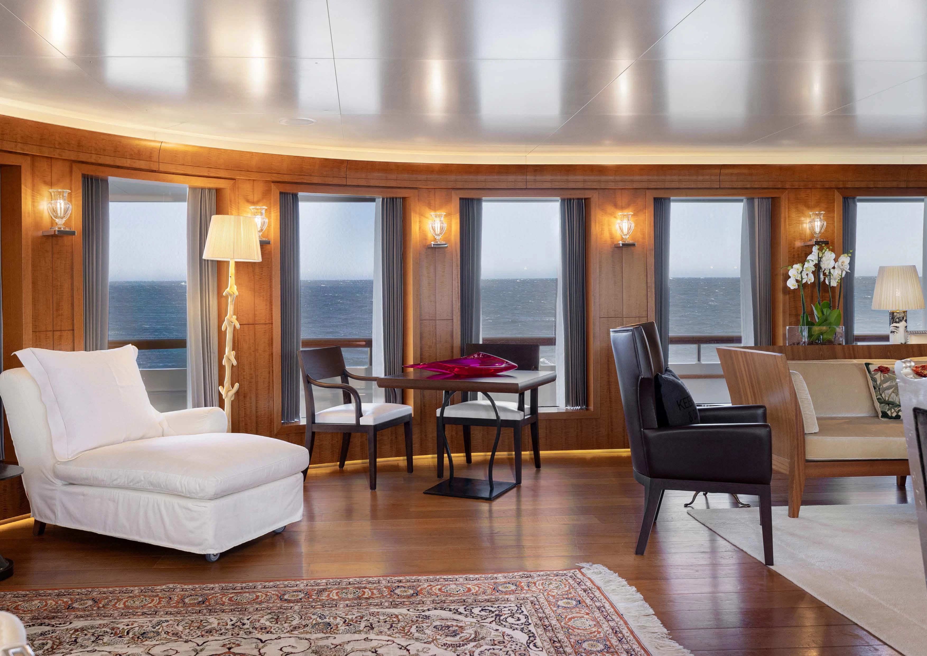 a living room with a large window aboard WEDGE TOO Yacht for Sale