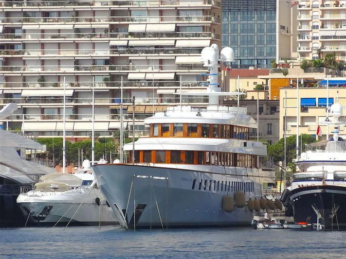 a large boat in a harbor aboard WEDGE TOO Yacht for Sale