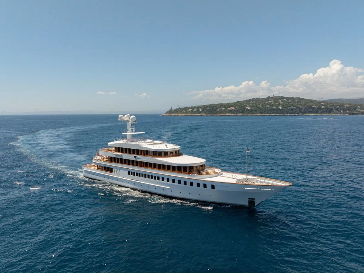 a large white ship in the water aboard WEDGE TOO Yacht for Sale