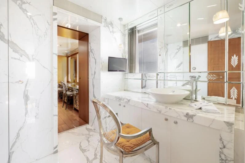 a bathroom with a sink and a mirror aboard WEDGE TOO Yacht for Sale