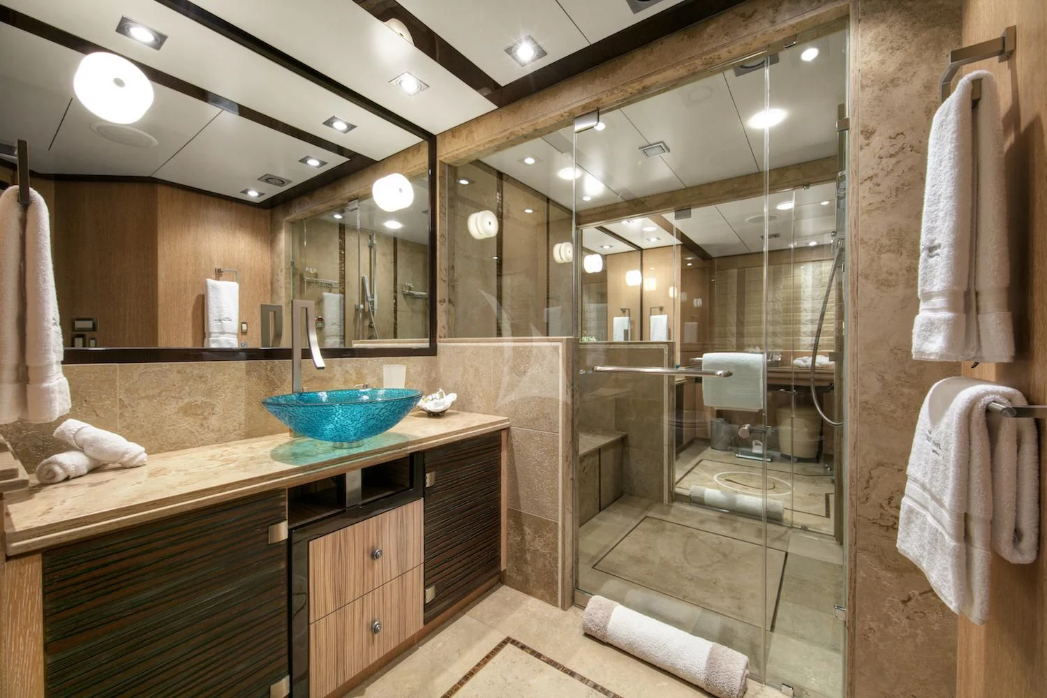 a bathroom with a large mirror aboard FIVE Yacht for Sale