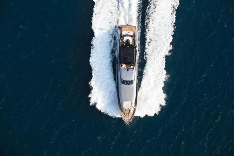 a white car on a blue surface aboard FIVE Yacht for Sale