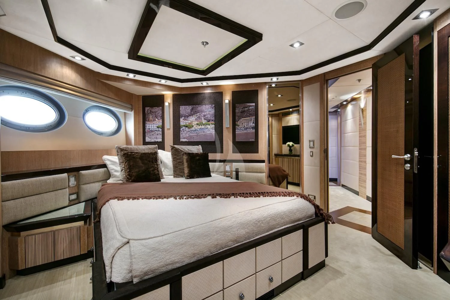 a room with a bed and a mirror aboard FIVE Yacht for Sale
