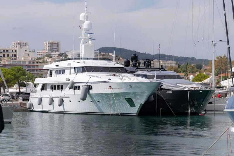 a boat docked at a pier aboard FIVE Yacht for Sale