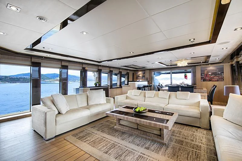 a living room with a large window aboard FIVE Yacht for Sale