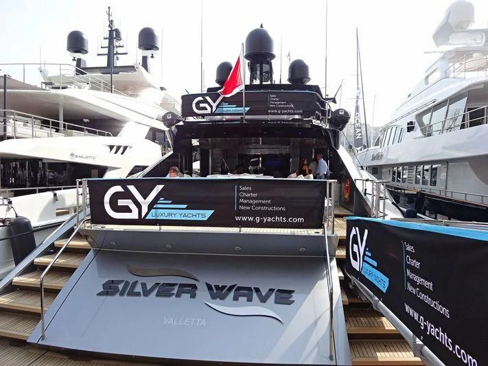 a boat with a sign on the front aboard FIVE Yacht for Sale