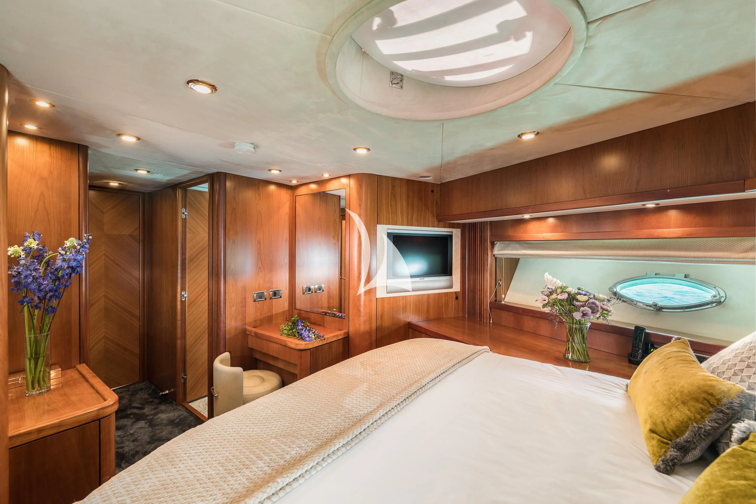 a bedroom with a large bed aboard FROGGY Yacht for Sale