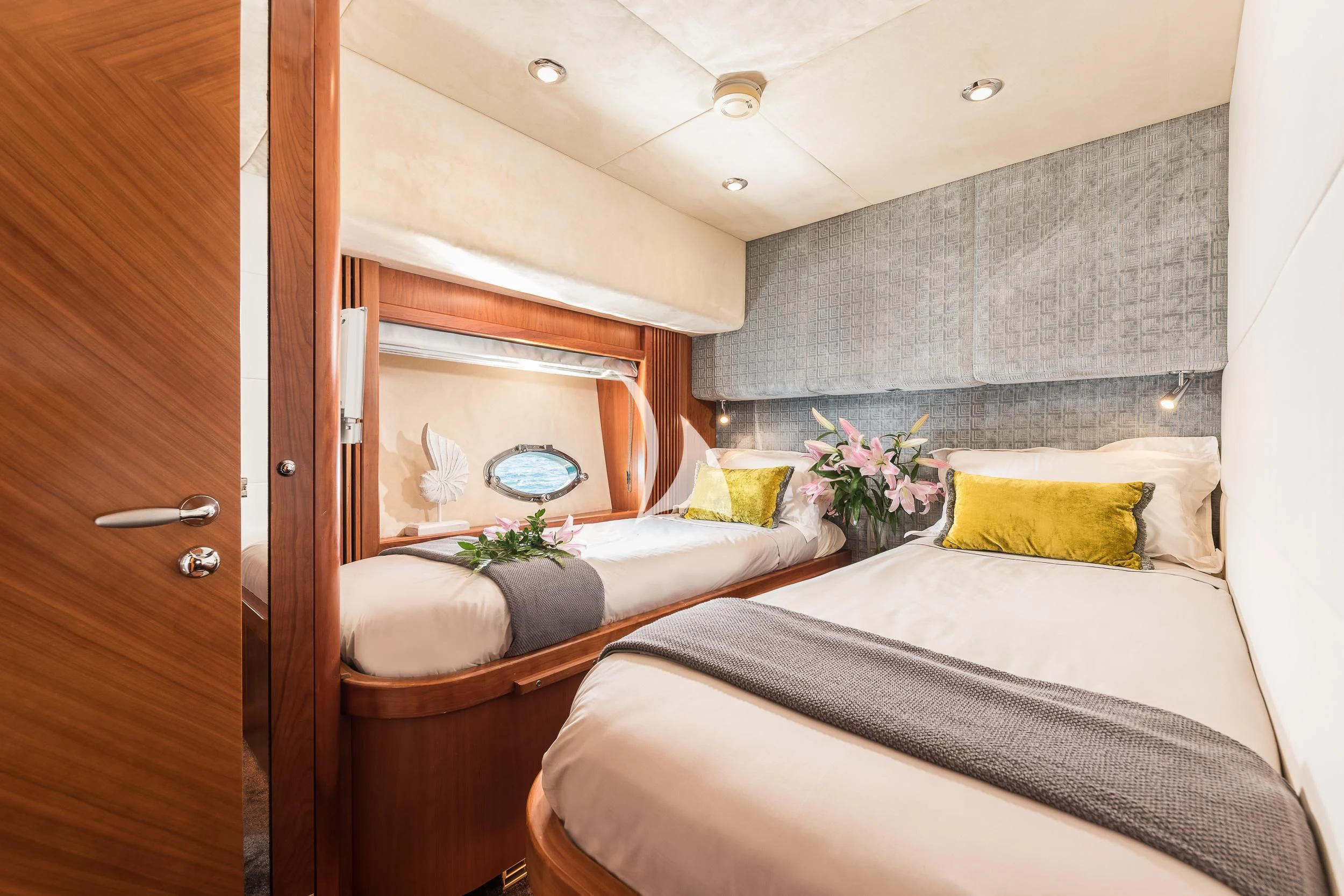 a room with a bed and a mirror aboard FROGGY Yacht for Sale