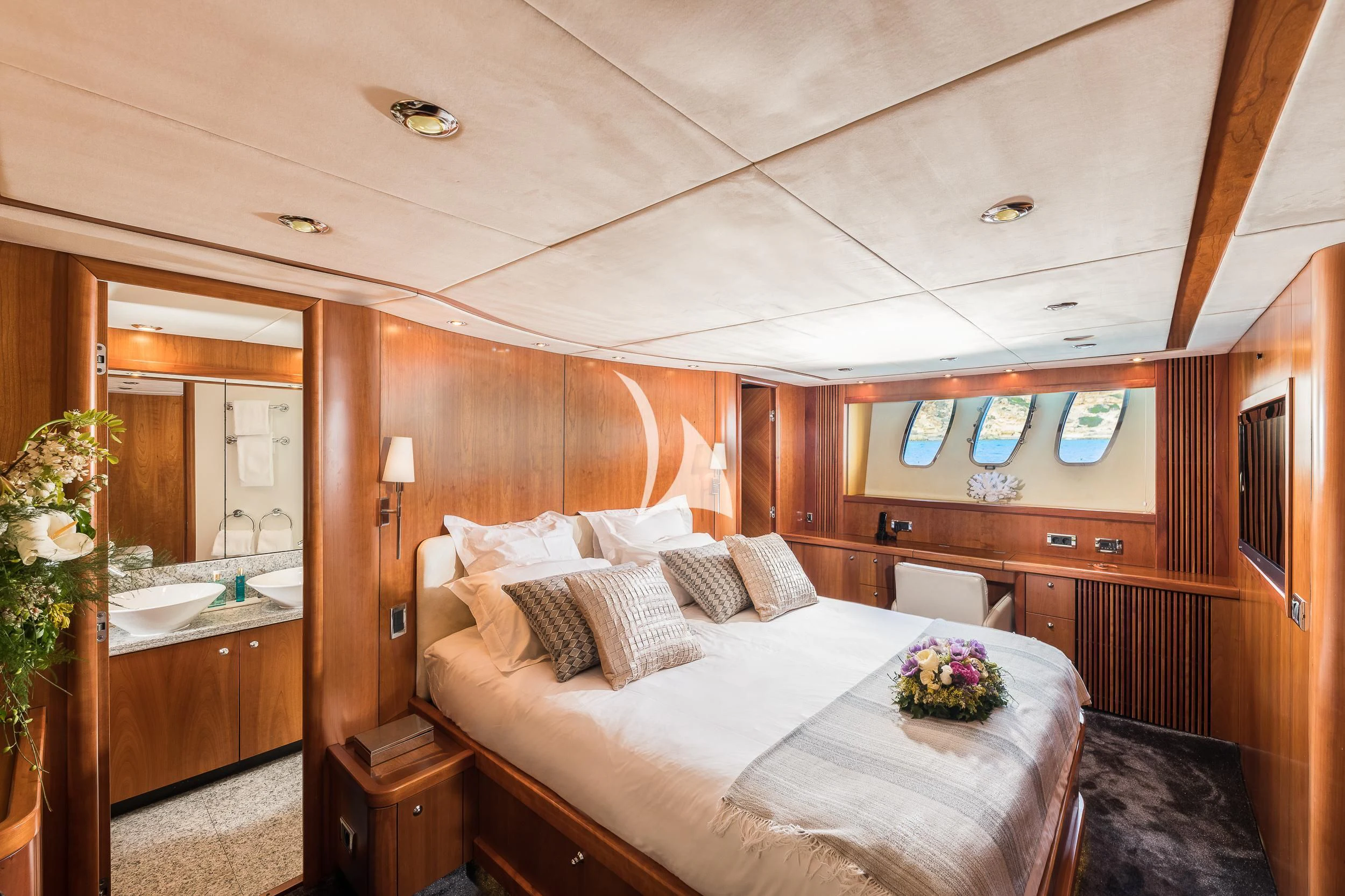 a bedroom with a bed and a mirror aboard FROGGY Yacht for Sale