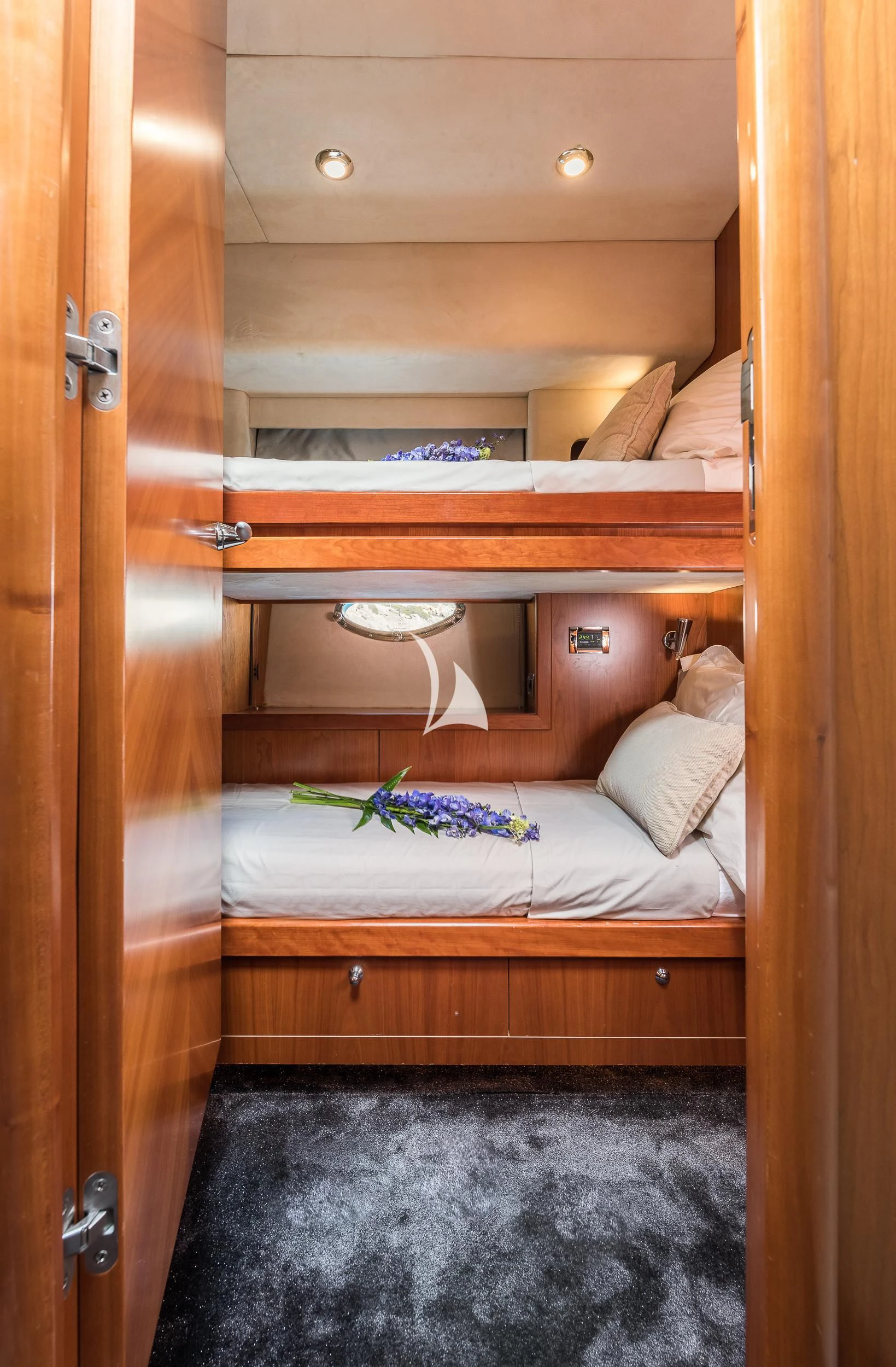 a closet with a bed and a desk aboard FROGGY Yacht for Sale