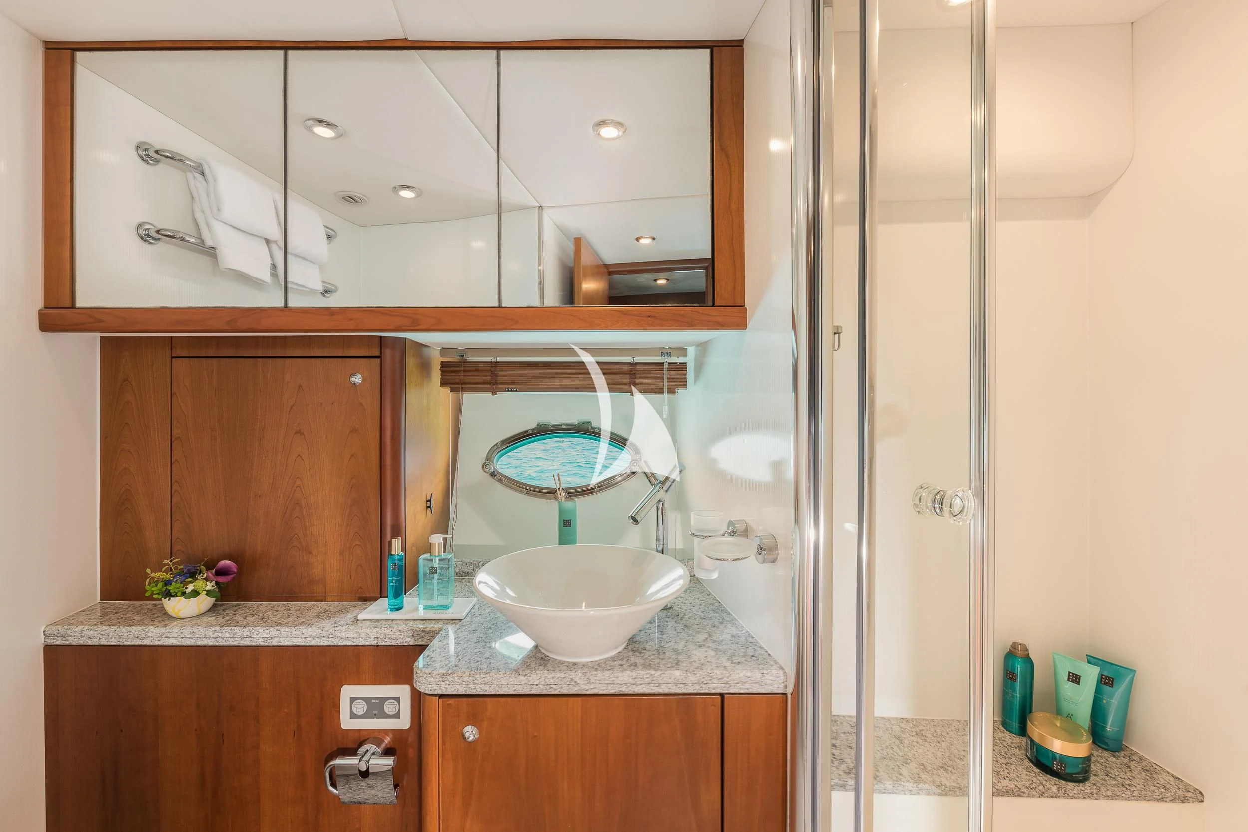 a bathroom with a sink and a mirror aboard FROGGY Yacht for Sale
