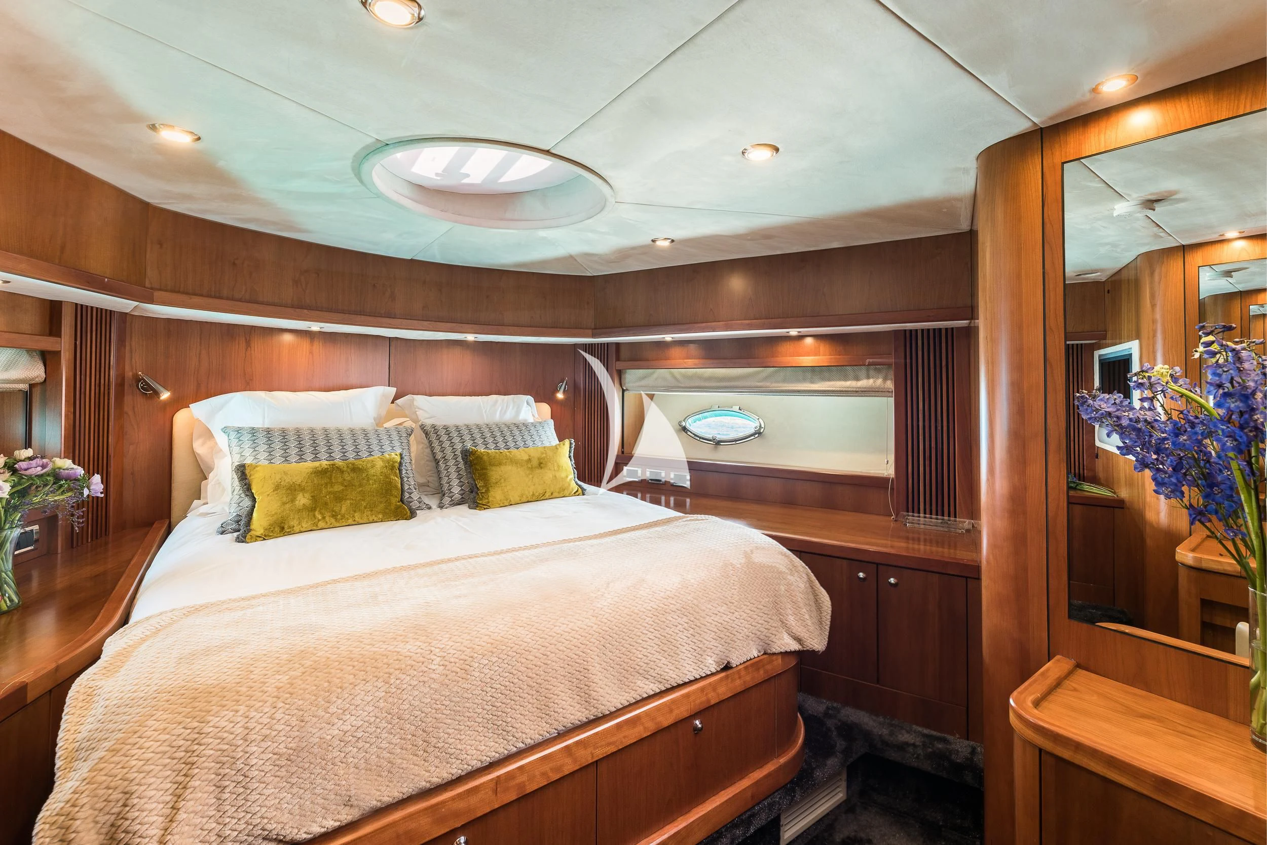 a bed with a white comforter aboard FROGGY Yacht for Sale