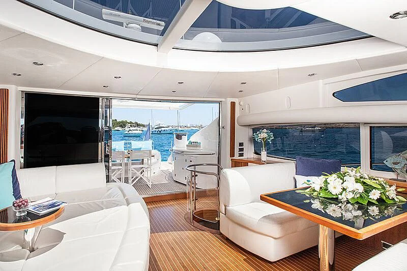 a room with a table and chairs aboard FROGGY Yacht for Sale
