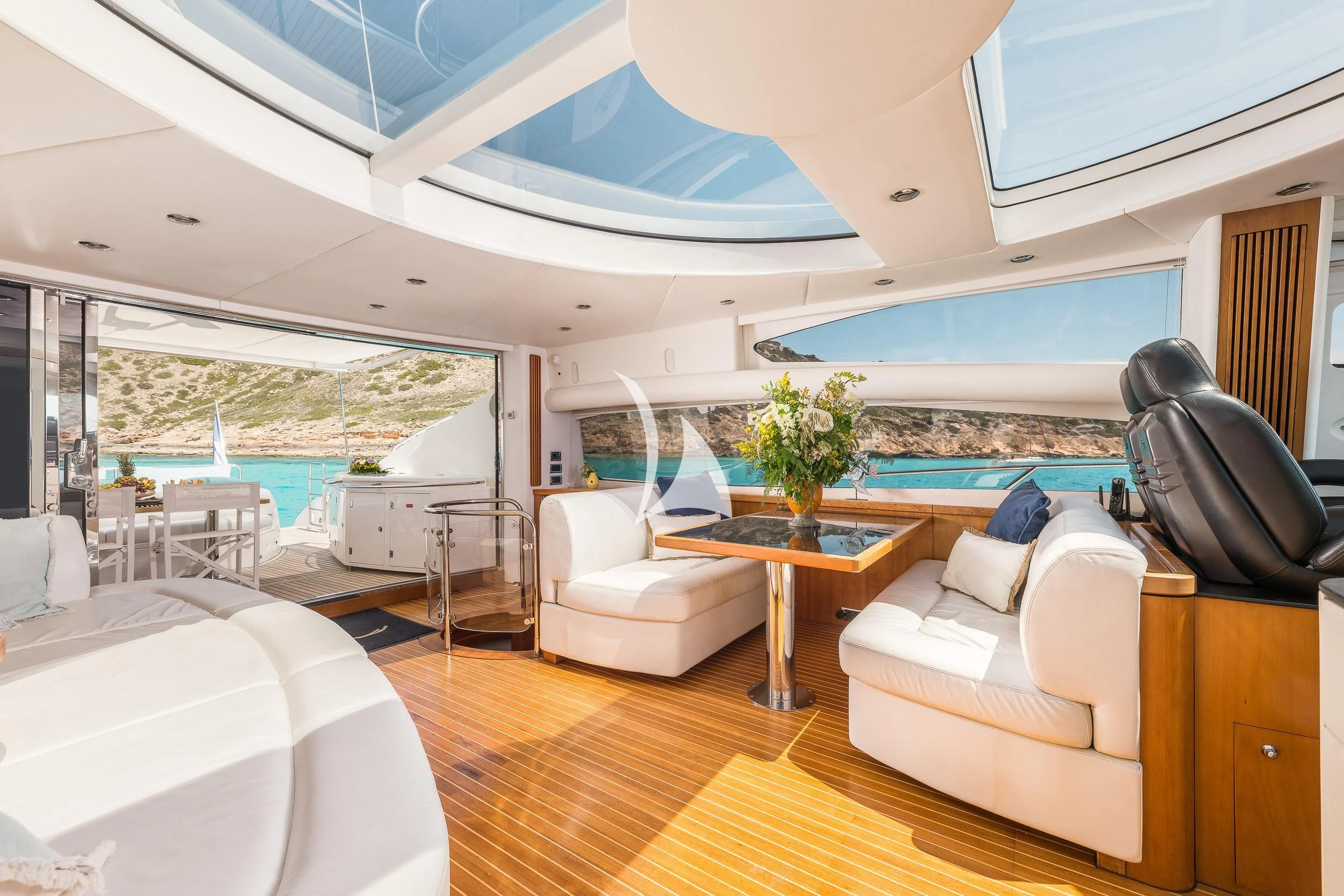 a room with a table and chairs aboard FROGGY Yacht for Sale