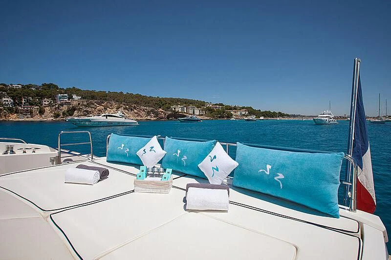 a boat with blue and white umbrellas on it aboard FROGGY Yacht for Sale