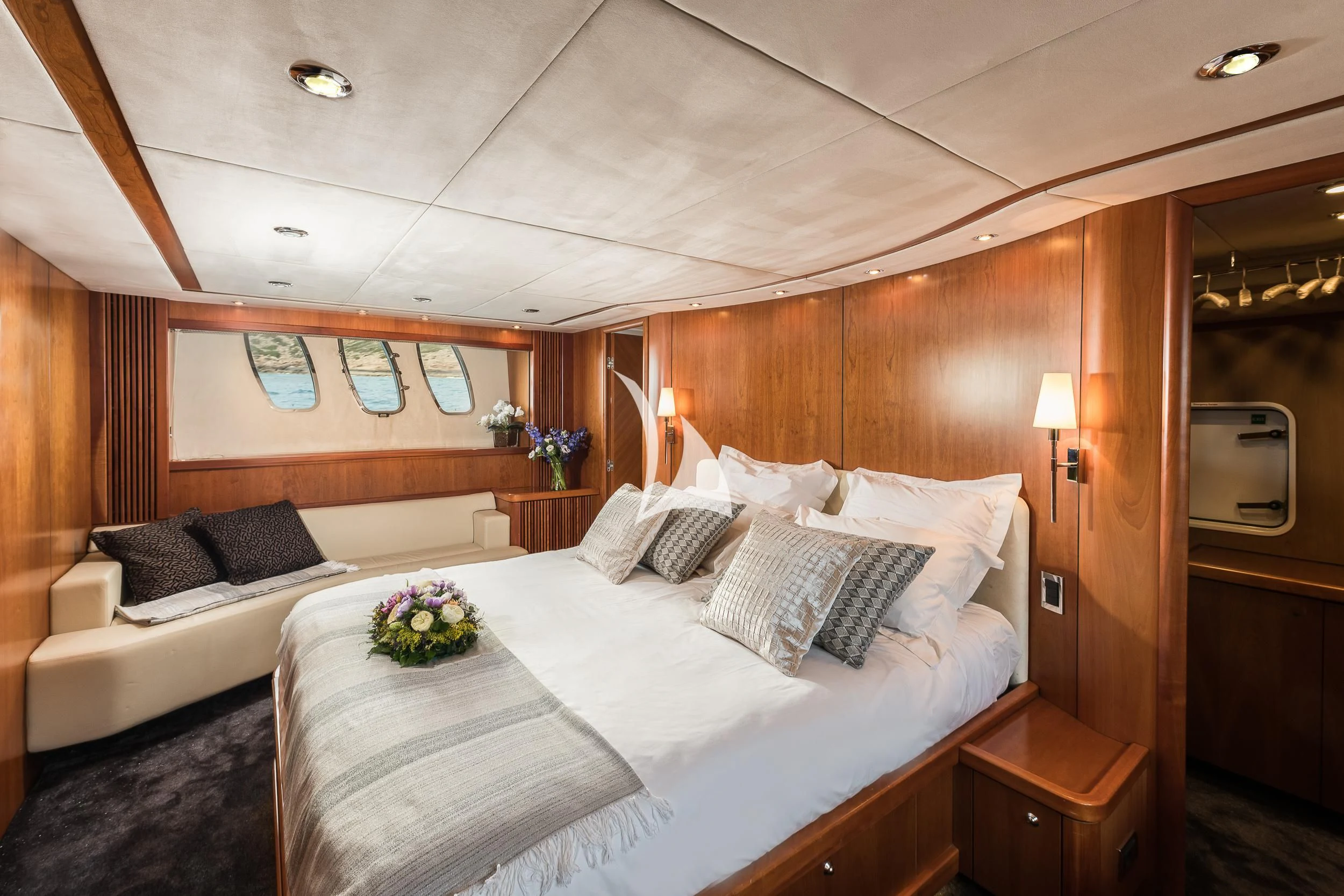 a room with a bed and a mirror aboard FROGGY Yacht for Sale