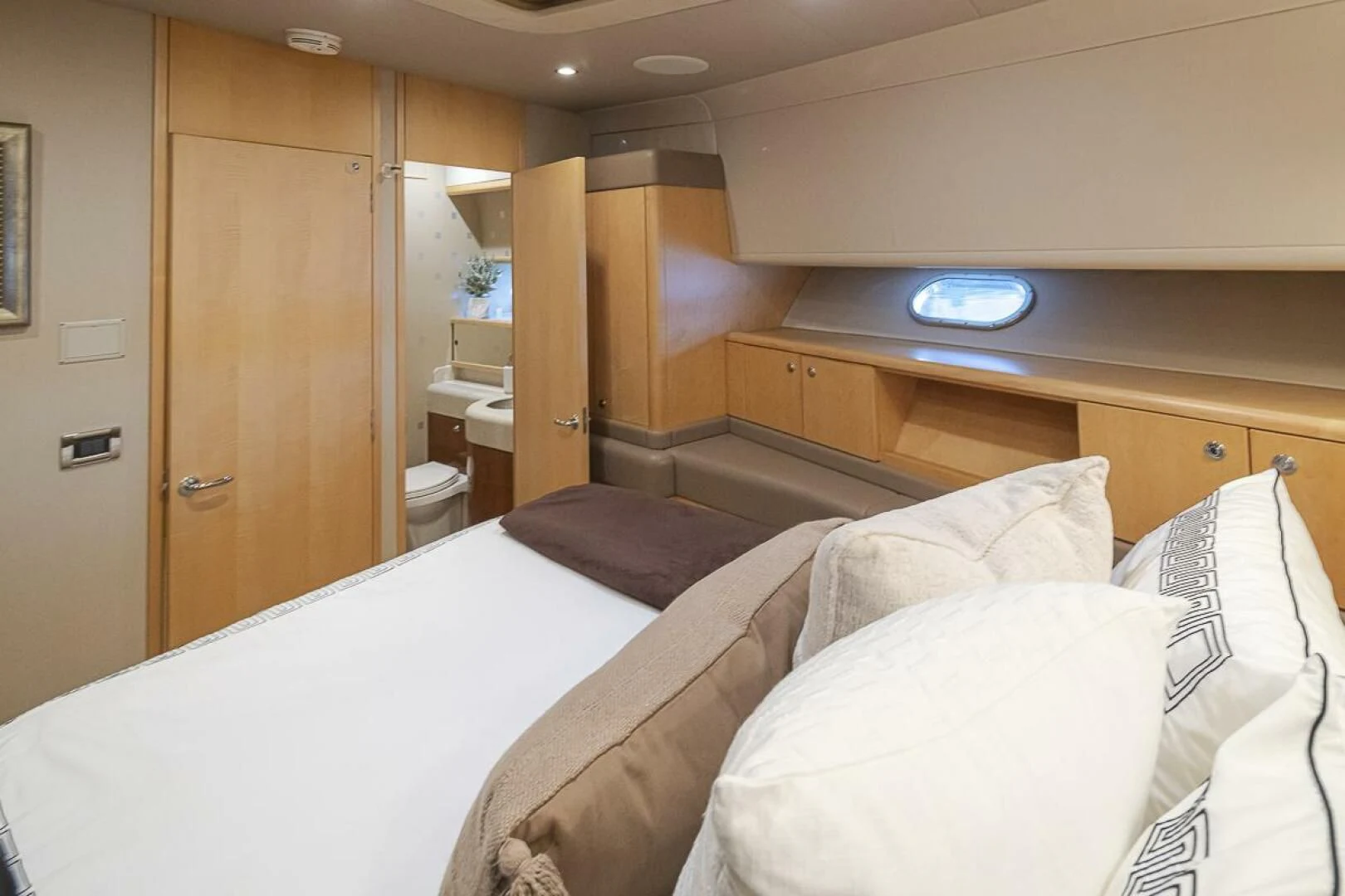 a room with a bed and a closet aboard SEA SPUR Yacht for Sale