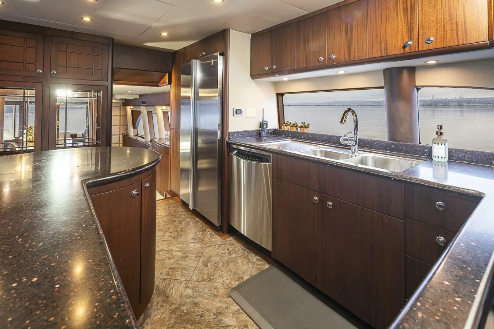 a kitchen with wooden cabinets aboard SEA SPUR Yacht for Sale