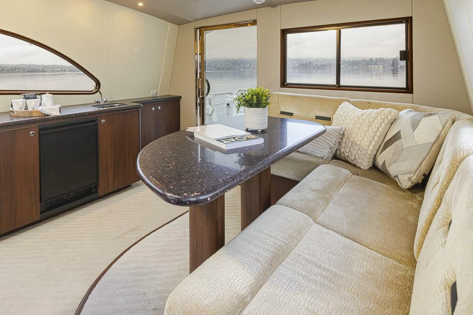a living room with a couch and coffee table aboard SEA SPUR Yacht for Sale
