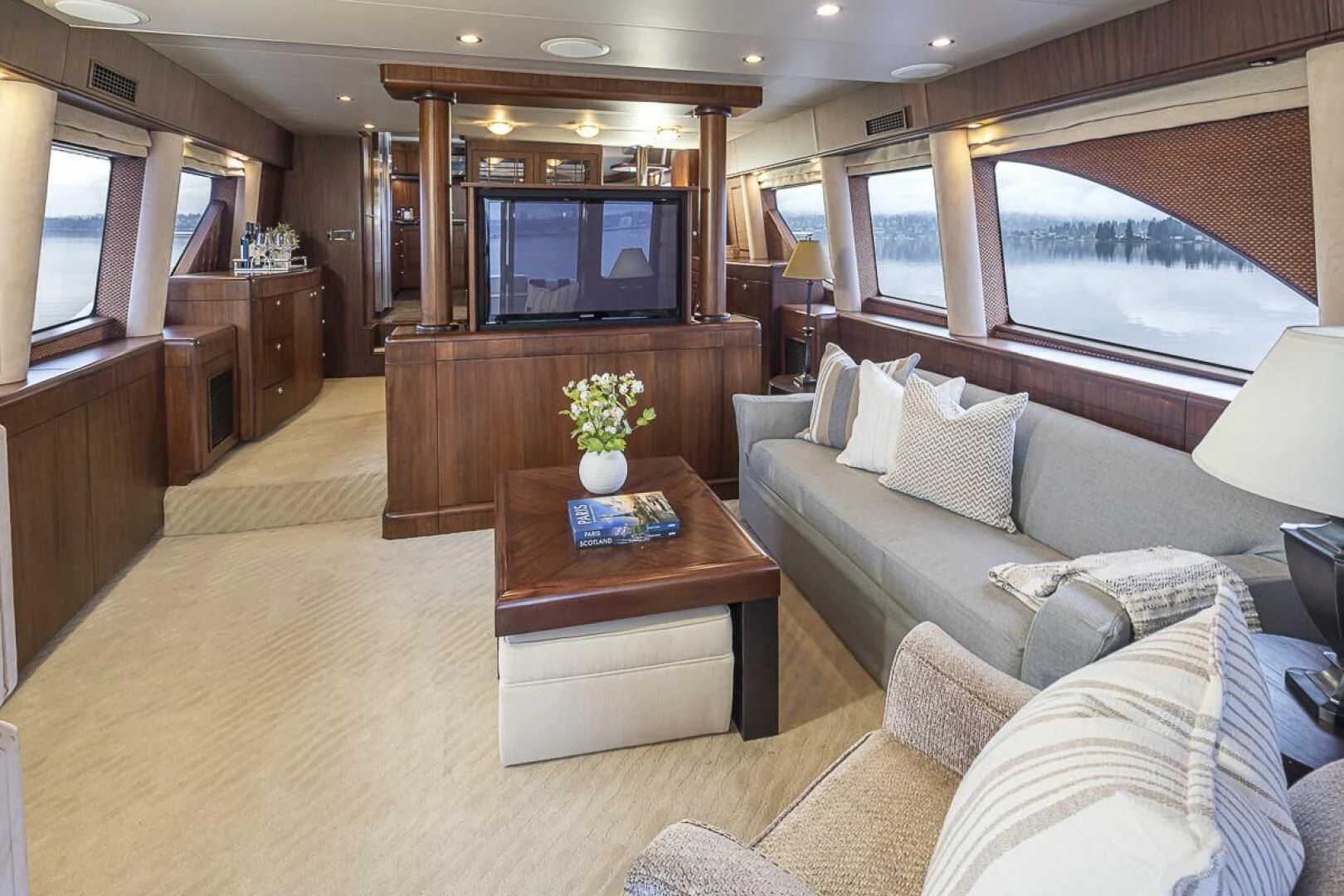 a living room with a large television aboard SEA SPUR Yacht for Sale