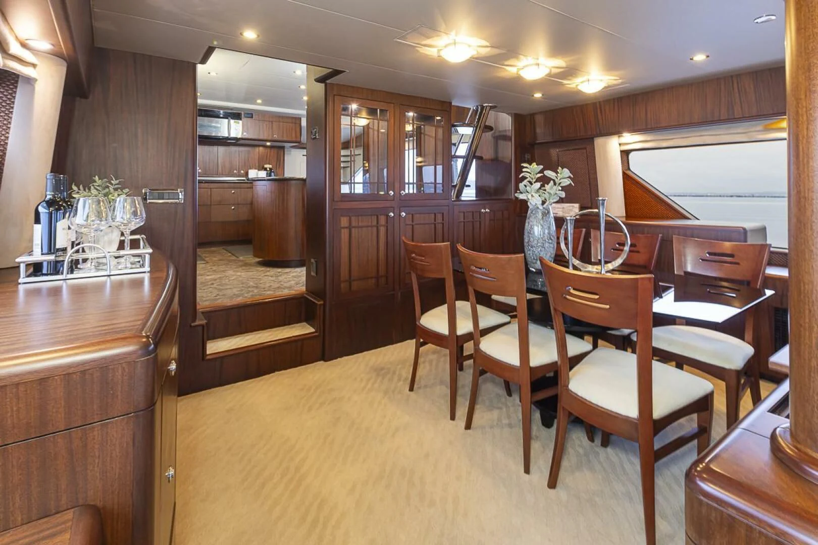 a room with a table chairs and a bench aboard SEA SPUR Yacht for Sale