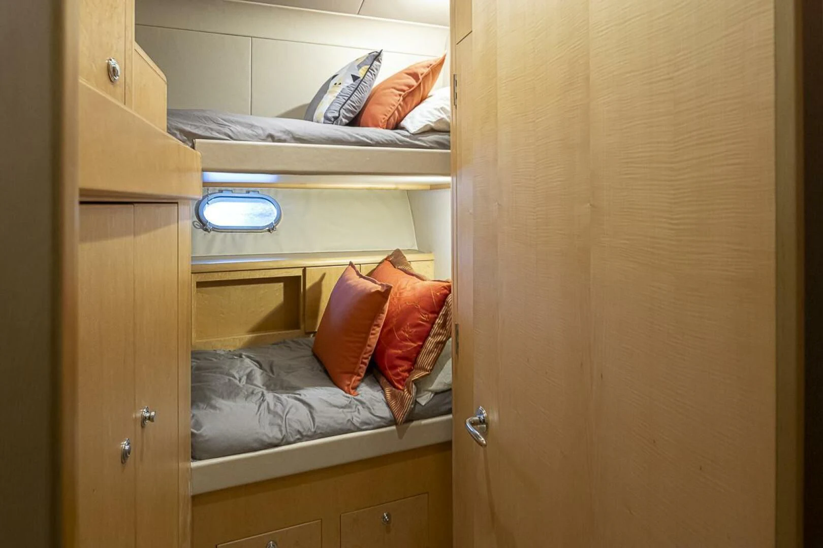 a closet with a bed and a shelf aboard SEA SPUR Yacht for Sale